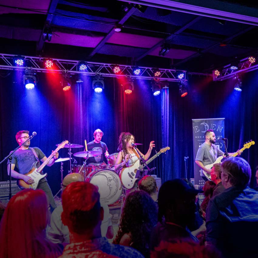 Eden performing live on stage